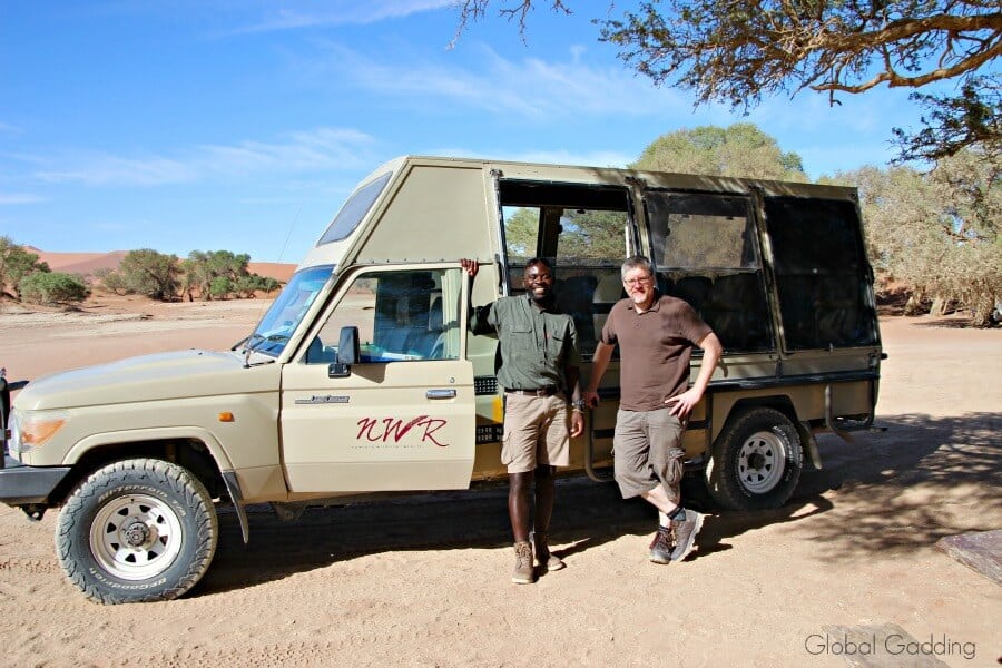Off-road 4x4 vehicle in desert sand in Sossusvlei Namibia