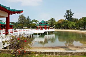 Bright red and jade-green exterior of Da Bo Gong Chinese Temple on Kusu Island, with traditional curved rooftops