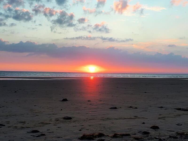 beautiful sunset over Rhossili Beach, Mumbles, Wales