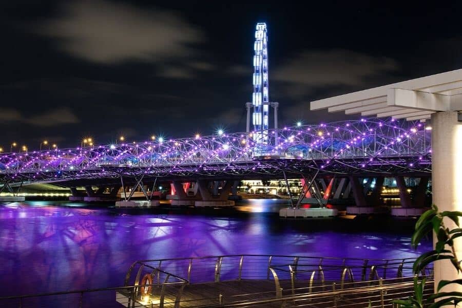 Singapore's helix bridge lit purple at nighttime