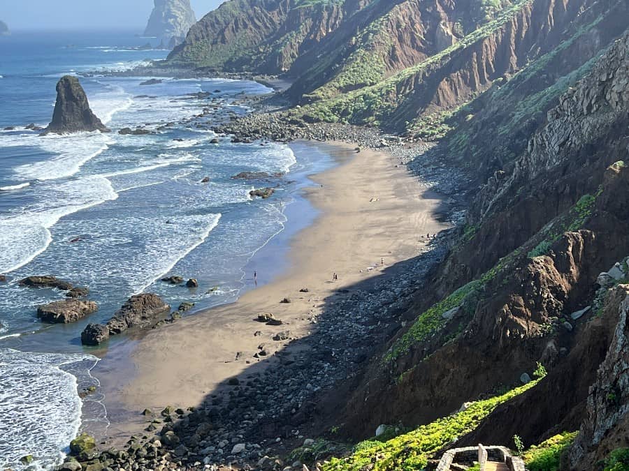 Coastal trail near Benijo in Anaga, Tenerife, with wild Atlantic views, volcanic cliffs and the Roques de Anaga offshore.