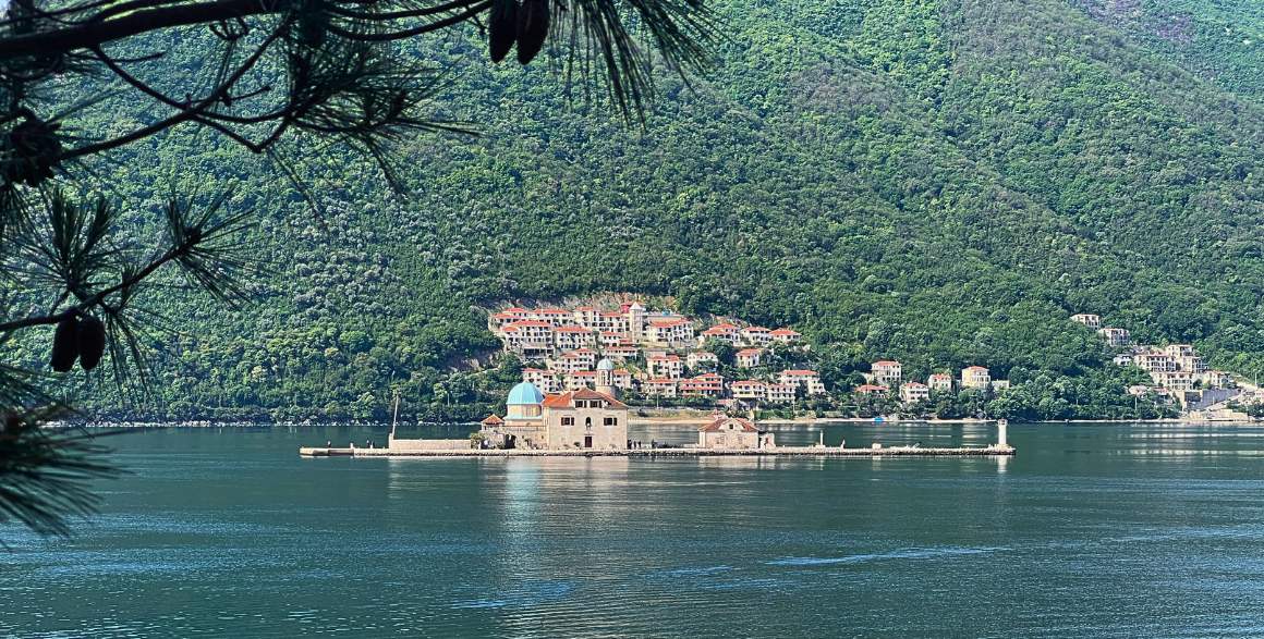  Our Lady of the Rocks, a picturesque Catholic church situated on a tiny, man-made island in the Bay of Kotor, near Perast, Montenegro.