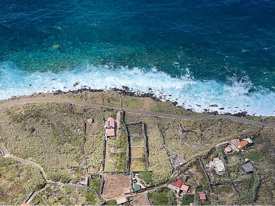 View from the Achadas da Cruz cable car descending a steep cliff to the coast on Madeira’s northwest shore.