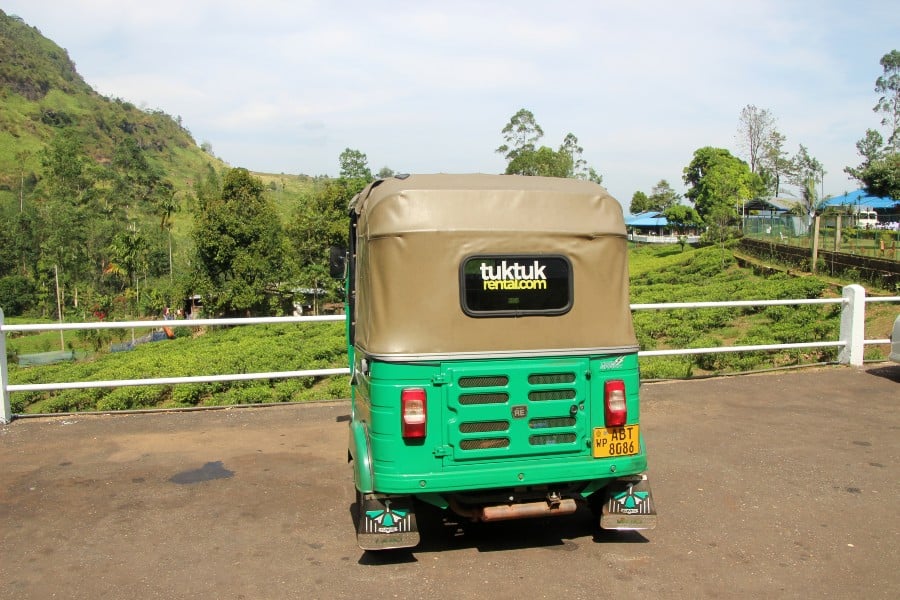 the back of a green tuk tuk