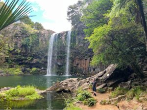 waterfall falling into a river - scenic road trip stops