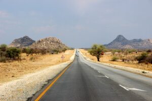 driving along the sealed B1 highway to Okahandja in Namibia during a 2 week road trip itinerary