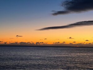 Sunset across the Atlantic Ocean from Jardim do Mar beach in Madeira.