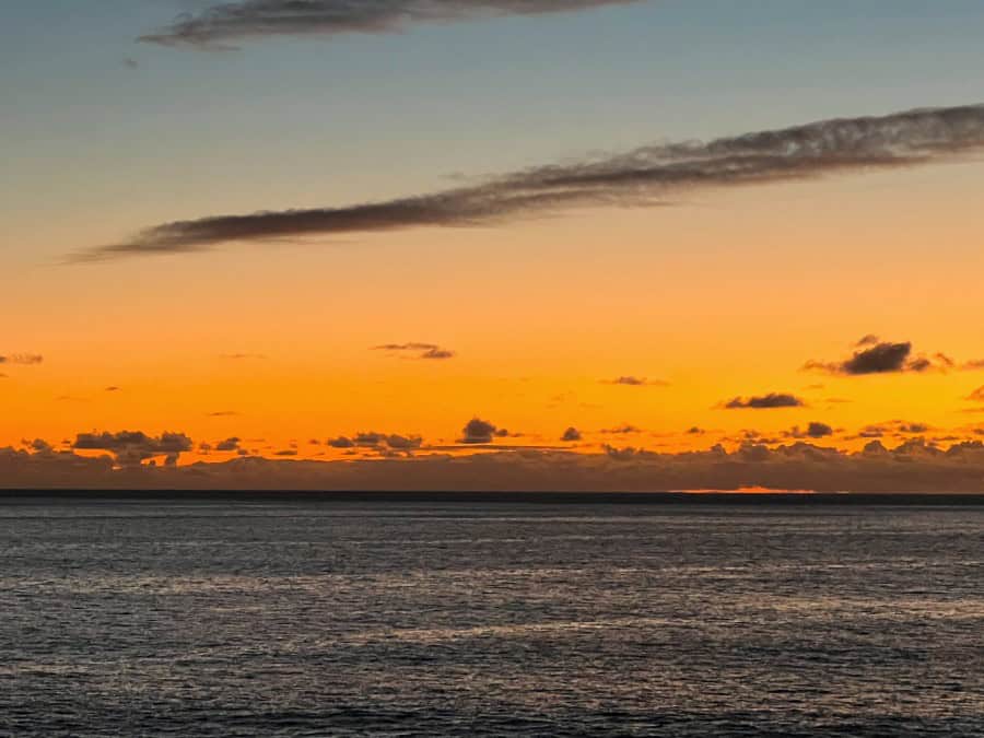 Orange sunset over the Atlantic Ocean seen from Jardim do Mar, Madeira.