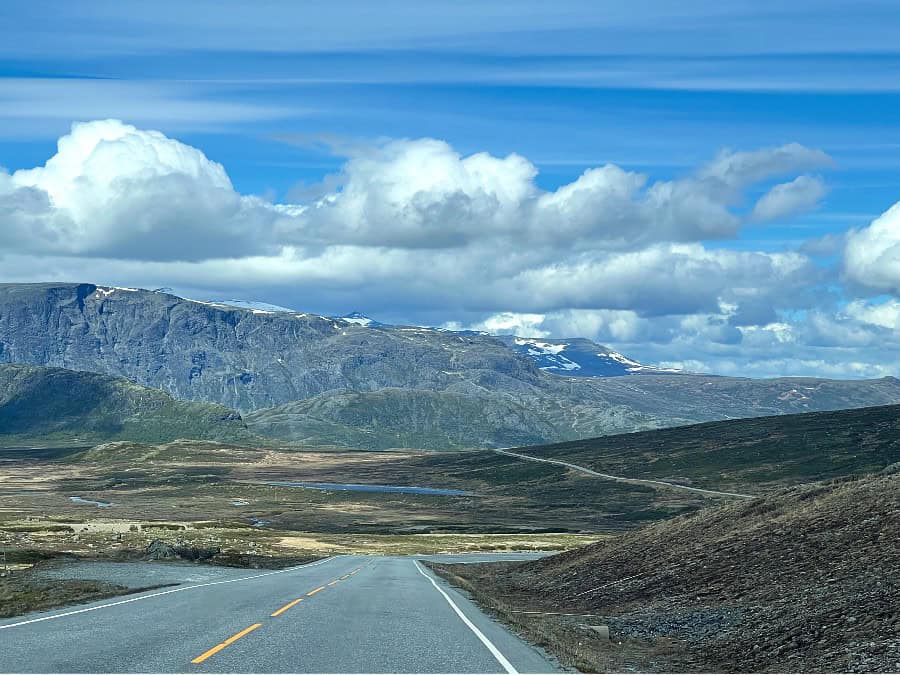Scenic road through Norwegian mountains during a summer road trip