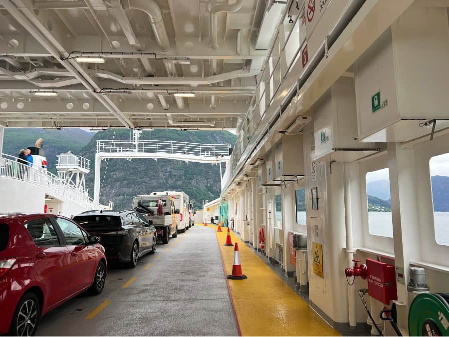 Cars parked on the vehicle deck of a ferry during a Norway road trip