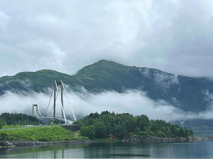 Low cloud and grey summer weather over a fjord and mountains in Norway