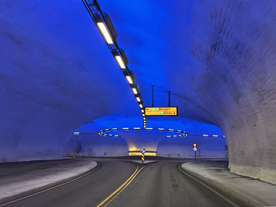 driving towards a roundabout inside one of Norway's tunnels