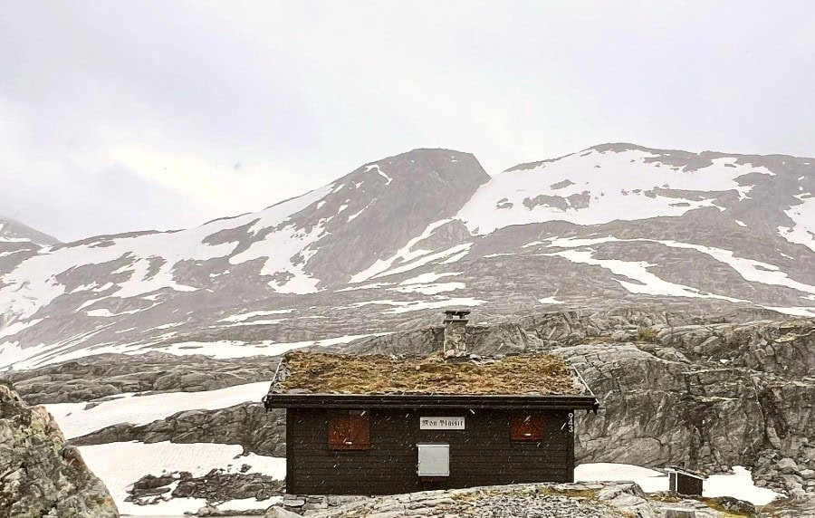 Snow and mist in the mountains showing seasonal road conditions in Norway